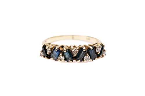 A sapphire and diamond ring in 9 carat yellow gold
