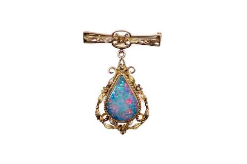 A opal doublet brooch in 9 carat yellow gold
