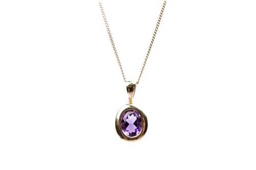 An amethyst pendant and necklace in 9 carat yellow gold