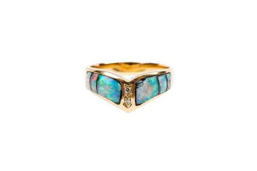 An opal inlay and diamond ring in 18 carat yellow gold