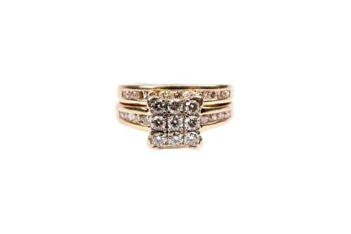 A diamond ring set in 9 carat yellow gold