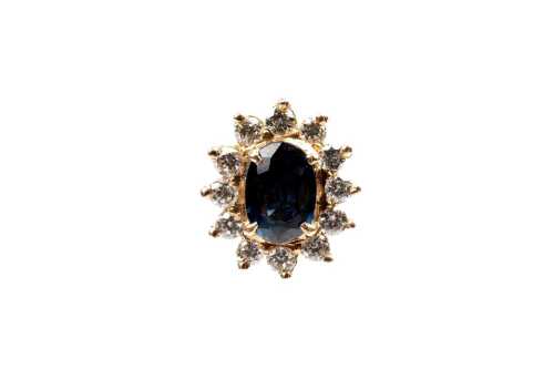 A pair of sapphire and diamond earrings in 18 carat yellow gold