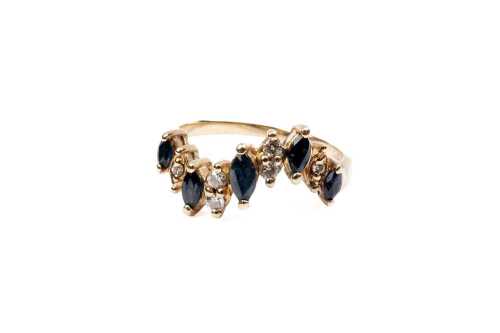 A sapphire and diamond ring in 9 carat yellow gold
