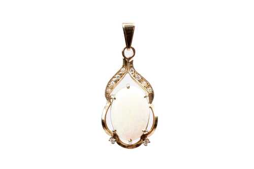 An opal and diamond pendant in 9 carat yellow gold