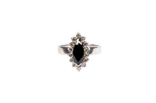 A vintage sapphire and diamond ring in 18 carat white gold