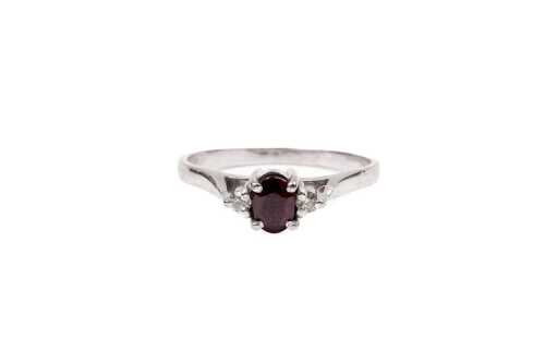 A ruby and diamond ring in 18 carat white gold
