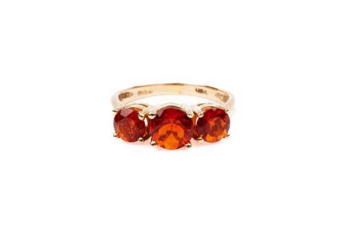 A spessartine garnet ring in 14 carat yellow gold