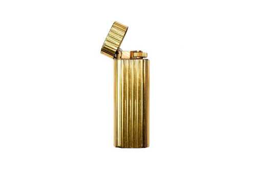 A vintage gold plated Cartier lighter
