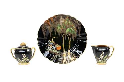 Three Carlton Ware Noire Royale porcelain pieces including 'Lily of the Valley' and 'New Heron'