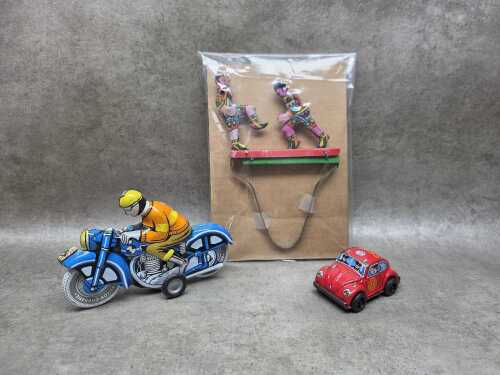 Three tin toys including Hungarian 'Ballon Cordatic' motorcycle