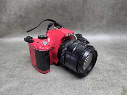 Pentax K-x digital SLR camera body in red