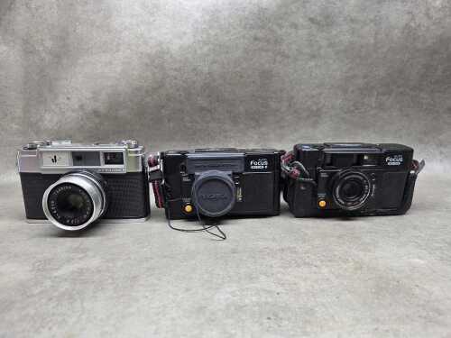 Three Yashica 35mm film cameras