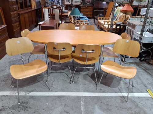 Contemporary oval dining table with eight chairs