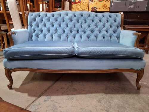 Blue upholstered two-seater sofa