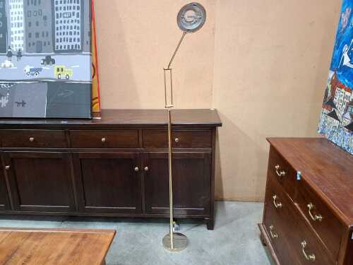 Adjustable brass floor lamp with dome shaped shade