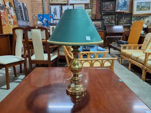 Cast metal table lamp with swirl-design column and green shade