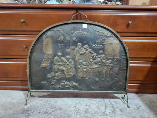 Embossed brass fireplace screen