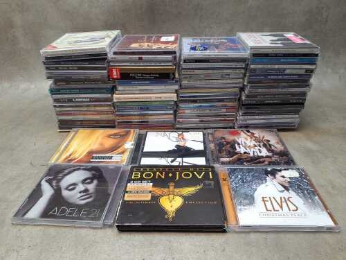 CDs, including Bon Jovi, Madonna, Elvis Presley