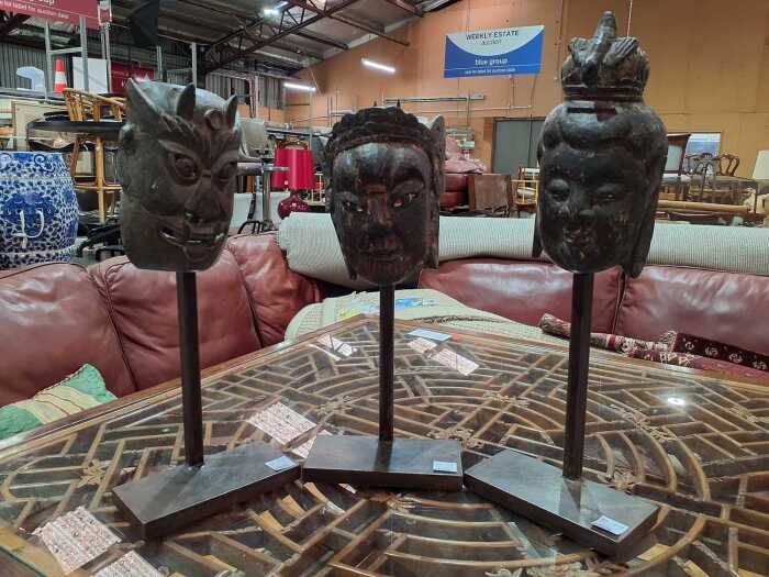 Three carved timber masks