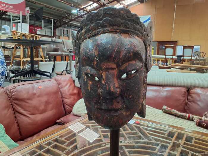 Three carved timber masks