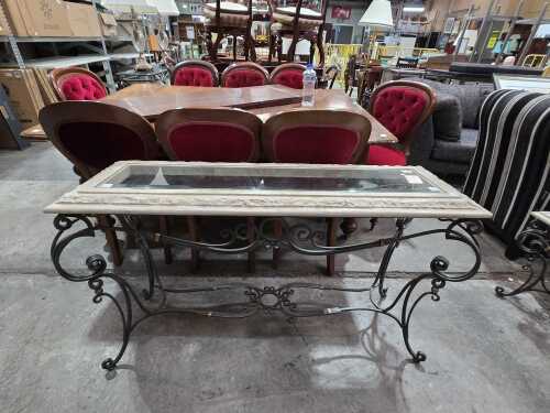 Glass-top console table with stone surrounds