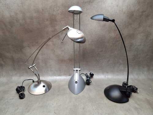 Three adjustable articulating desk lamps