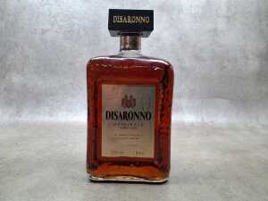 Disaronno Italian Liqueur, one bottle and three decorative empty bottles - 2
