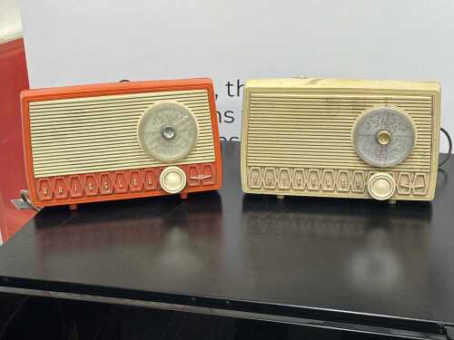 Two Kriesler 'Newscaster' model 11-99 radios in orange and ivory