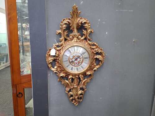 Wall clock with carved gilt case