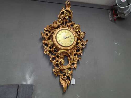 Wall clock with carved gilt case