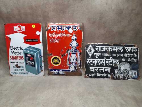 Three vintage enamel signs, including HKS electric Motor Starters