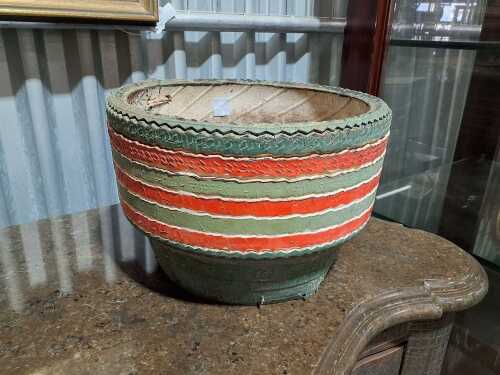 Vintage green and red planter made from a Dunlop tyre