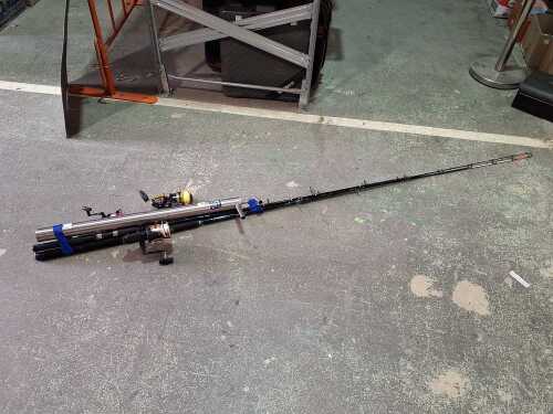 Three fishing rods and a bait pump