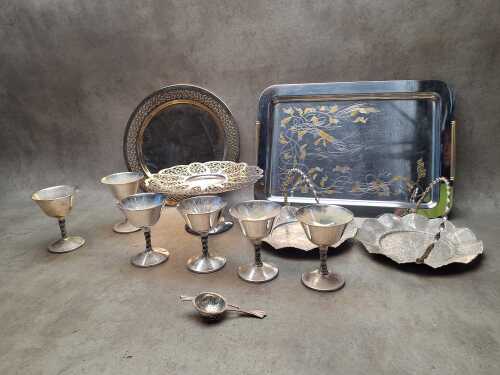 Assorted metal serving ware including silver-plated goblets, cake plates, trays, etc