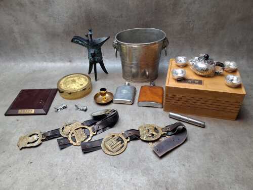 Group of metalware including pewter ice bucket and hip flasks, reproduction Chinese bronze wine cup, horse brasses, etc