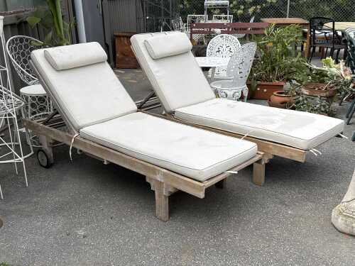 Pair of teak outdoor sun lounges