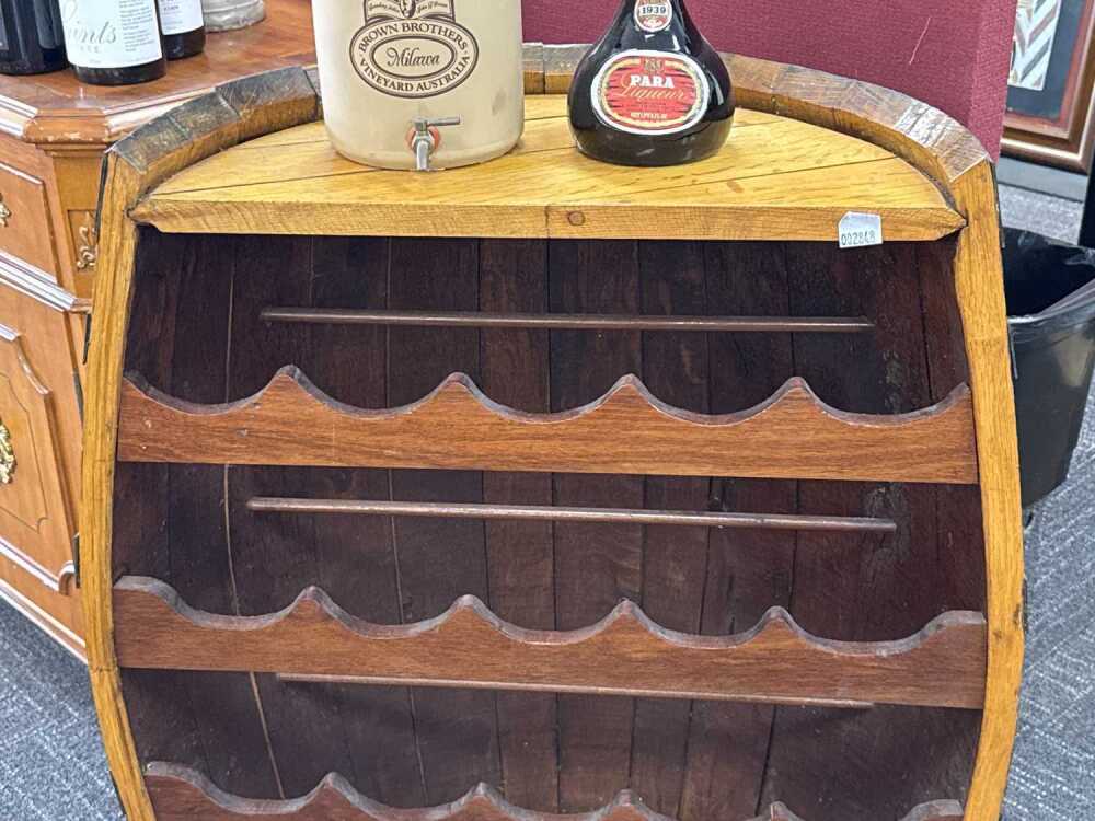 Rustic half barrel-shaped wine rack