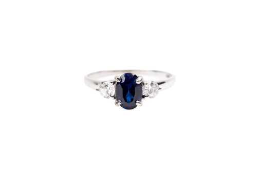 A synthetic sapphire and cubic zirconia ring in 9 carat white gold