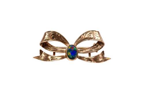 A vintage opal doublet bow brooch in 9 carat yellow gold