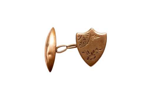 A single shield cufflink in 15 carat yellow gold