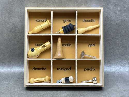Collection of Oiseaux bird call whistles in timber box