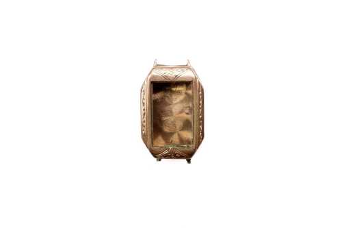 An empty watch case in 9 carat rose gold