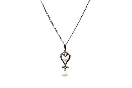 A Mikimoto pendant on necklace in sterling silver