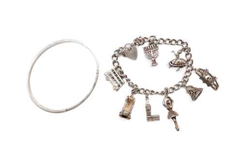 A charm bracelet and a bangle in sterling silver