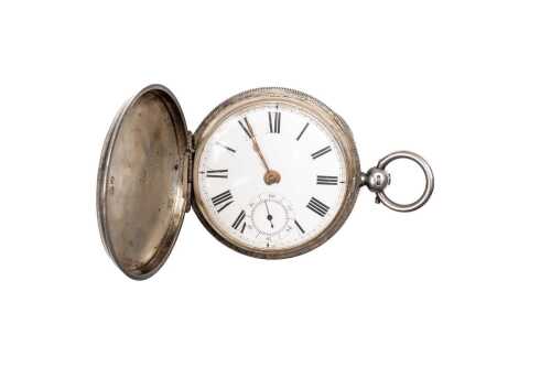 An antique pocket watch in sterling silver