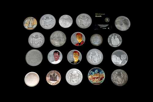 Group of assorted metal tokens