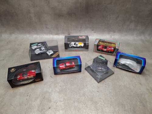 Seven boxed 1:43 die cast model cars