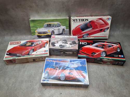 Six boxed plastic model car sets