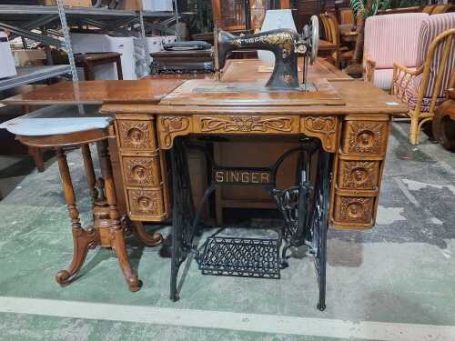 Singer treadle sewing machine in timber cabinet