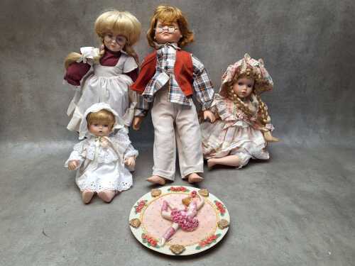 Four porcelain collector dolls